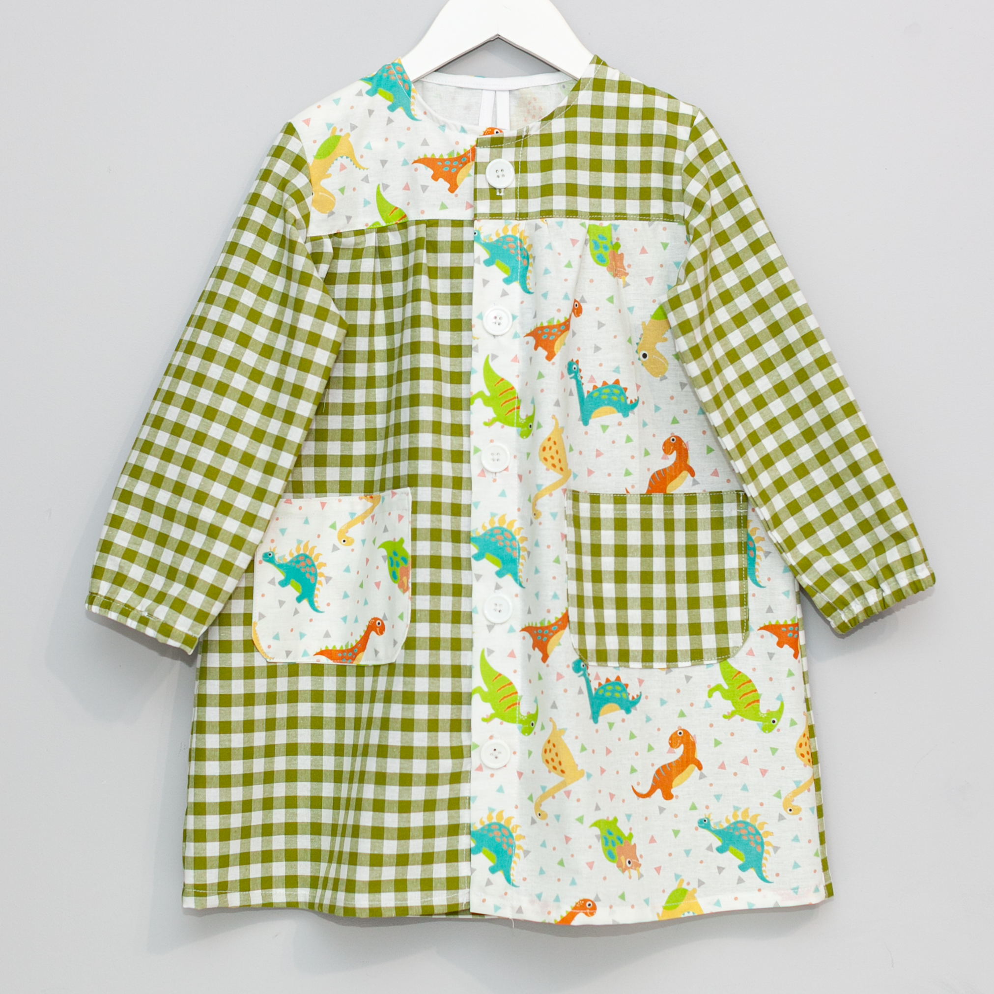 Bata escolar botones Dinosaurios